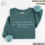May include: Blue spruce-colored sweatshirt with the text "i might be laid back but i can lean forward real quick" in white. The sweatshirt has a crew neck and long sleeves. The brand logo "AP" is in the upper left corner.